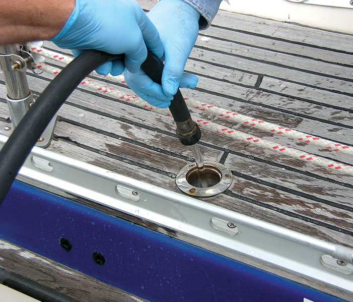 Flushing a holding tank